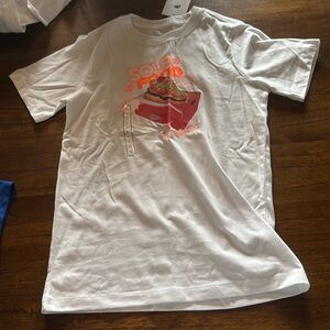 White Nike T-Shirt. Brand new with tags. Size is youth large